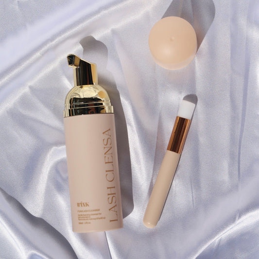 Wink Supplies AU Lash Clensa foaming lash cleanser with a gold pump, cleansing brush and beige cap.