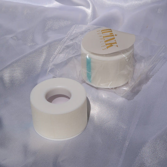 White sensitive lash tape roll beside its Wink Supplies AU packaging o
