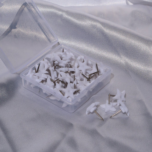 Open clear box of white star lash glue nozzle pins with loose pins displayed alongside.
IMG_5584.JPG